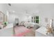 Bright bedroom has a ceiling fan, a large window and white furnishings at 1358 Peppergrass Nw Trl, Acworth, GA 30101