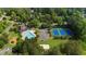 Aerial view highlights the community amenities, including a pool and tennis courts at 1358 Peppergrass Nw Trl, Acworth, GA 30101