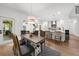 Dining room with wood table, chairs, and view of the kitchen and staircase at 1358 Peppergrass Nw Trl, Acworth, GA 30101