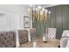 Dining area showcasing a wood table, fabric chairs, and stylish lighting at 1358 Peppergrass Nw Trl, Acworth, GA 30101