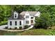 Inviting traditional two-story home with manicured lawn and detailed architectural design at 1358 Peppergrass Nw Trl, Acworth, GA 30101