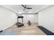 Finished basement with exercise room including wood flooring, a fan, and fitness equipment at 1358 Peppergrass Nw Trl, Acworth, GA 30101