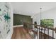 Hallway with modern lighting and chandelier above staircase at 1358 Peppergrass Nw Trl, Acworth, GA 30101