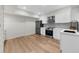 Modern kitchen has new stainless steel appliances, white cabinets, and countertops at 1358 Peppergrass Nw Trl, Acworth, GA 30101