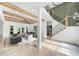 Spacious living room with wood beams, hardwood floors, and modern furnishings at 1358 Peppergrass Nw Trl, Acworth, GA 30101