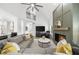 Spacious living room featuring a fireplace, sectional sofa, and open-concept design with soaring ceilings at 1358 Peppergrass Nw Trl, Acworth, GA 30101
