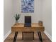 Home office featuring modern desk, new floors, artwork, and sleek decor at 1358 Peppergrass Nw Trl, Acworth, GA 30101