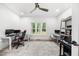 Bright office space with multiple workstations, large window, and neutral tones creating a productive environment at 1358 Peppergrass Nw Trl, Acworth, GA 30101