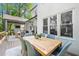 Outdoor dining area on wooden deck with seating for six offers a serene space to entertain at 1358 Peppergrass Nw Trl, Acworth, GA 30101