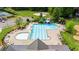 Aerial view of the sparkling community pool with lounge chairs and green space at 1358 Peppergrass Nw Trl, Acworth, GA 30101