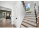 Elegant staircase featuring wood treads, white risers, and modern railing detail at 1358 Peppergrass Nw Trl, Acworth, GA 30101