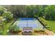 Aerial view of two community tennis courts with lights and a covered rest area at 1358 Peppergrass Nw Trl, Acworth, GA 30101