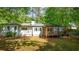 View of the back of the home, including a wooden deck perfect for outdoor living at 3294 Mcclure Bridge Rd, Duluth, GA 30096