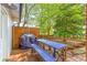 Outdoor deck area equipped with a grill and dining set, ideal for entertaining guests at 3294 Mcclure Bridge Rd, Duluth, GA 30096