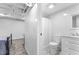 Basement bathroom featuring a white vanity, marble tile floor and white shiplap at 3294 Mcclure Bridge Rd, Duluth, GA 30096