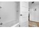 A pristine bathroom features a tub and tiled shower with an open door at 3294 Mcclure Bridge Rd, Duluth, GA 30096