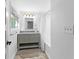 Bright bathroom features a gray vanity with granite countertops and a neutral color palette at 3294 Mcclure Bridge Rd, Duluth, GA 30096