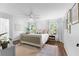 Bright bedroom with hardwood floors, neutral decor, and plenty of natural light from large windows at 3294 Mcclure Bridge Rd, Duluth, GA 30096