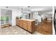 Open-concept kitchen with tile flooring, wooden countertops and cabinetry, open dining, and living area at 3294 Mcclure Bridge Rd, Duluth, GA 30096