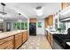 Spacious kitchen features wooden cabinets, tile floor, modern appliances, and sliding door to deck at 3294 Mcclure Bridge Rd, Duluth, GA 30096