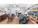 Open living room with hardwood floors, built-in shelving, and a view into the kitchen at 3294 Mcclure Bridge Rd, Duluth, GA 30096