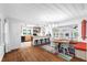 Open floor plan with dining area featuring white ceiling beams, hardwood floors, and open kitchen at 3294 Mcclure Bridge Rd, Duluth, GA 30096