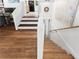 Hardwood stairs featuring white accents leading to the upper level of this home at 3294 Mcclure Bridge Rd, Duluth, GA 30096