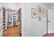 Spacious walk-in closet with custom shelving and hardwood floors, offering ample storage at 3294 Mcclure Bridge Rd, Duluth, GA 30096