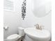 Stylish powder room with a modern sink, toilet, and elegant fixtures at 500 Garvin Dr, Woodstock, GA 30189