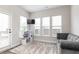 Cozy bonus room with three windows, offering ample natural light and a comfortable seating area at 500 Garvin Dr, Woodstock, GA 30189