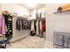 Spacious walk-in closet with custom shelving and organization system for optimal storage at 500 Garvin Dr, Woodstock, GA 30189