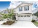 Inviting two-story townhouse boasts of beautiful landscaping and a convenient two-car garage at 500 Garvin Dr, Woodstock, GA 30189