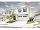 Charming two-story townhouse with a two-car garage, beautiful landscaping and a welcoming entrance at 500 Garvin Dr, Woodstock, GA 30189