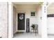 Charming front porch with a welcoming wreath, a comfortable chair and a 'WELCOME' sign at 500 Garvin Dr, Woodstock, GA 30189