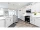 Modern kitchen with white countertops, a stainless steel dishwasher, and sleek cabinets, a chef's dream at 500 Garvin Dr, Woodstock, GA 30189