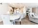 Charming kitchen adjacent to a dining area with large island and modern decor at 500 Garvin Dr, Woodstock, GA 30189