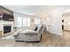 Bright living room features a fireplace, large windows, and open floor plan at 500 Garvin Dr, Woodstock, GA 30189
