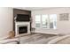 Cozy living room features a fireplace with television, and an inviting seating area at 500 Garvin Dr, Woodstock, GA 30189
