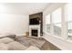 Bright living room boasts a fireplace and large windows for ample natural light at 500 Garvin Dr, Woodstock, GA 30189