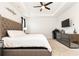 Beautiful main bedroom showcasing carpet, tray ceiling with fan, and mirrored dresser at 500 Garvin Dr, Woodstock, GA 30189