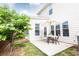 Outdoor patio featuring outdoor table with chairs and shade umbrella, backed by a white-sided home at 500 Garvin Dr, Woodstock, GA 30189