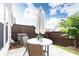Private patio with outdoor seating and umbrella, perfect for enjoying sunny days at 500 Garvin Dr, Woodstock, GA 30189