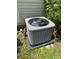 View of the air conditioning unit surrounded by leafy greenery at 7260 Cox Rd, Cumming, GA 30028