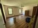 Spacious bedroom with wood flooring, two windows and neutral colored walls at 7260 Cox Rd, Cumming, GA 30028