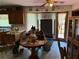 Bright kitchen area with wooden cabinets and a view to the outside at 7260 Cox Rd, Cumming, GA 30028