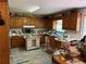 Functional kitchen with wood cabinets, ample counter space, and an island at 7260 Cox Rd, Cumming, GA 30028
