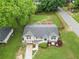 Aerial view of a home showcasing its landscaped yard, patio area, and surrounding neighborhood at 984 Ridgecrest Se Dr, Smyrna, GA 30080