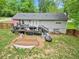 Backyard featuring a deck with seating, raised garden beds and a hammock, perfect for outdoor living at 984 Ridgecrest Se Dr, Smyrna, GA 30080