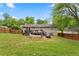 Backyard with a wooden fence, a hammock, and an umbrella on the deck at 984 Ridgecrest Se Dr, Smyrna, GA 30080