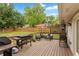 Outdoor deck with grilling station, stylish seating, and fenced yard at 984 Ridgecrest Se Dr, Smyrna, GA 30080